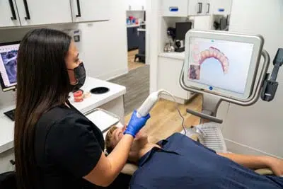 patient receiving dental care during their first appointment at North Texas Smiles in Fort Worth, TX