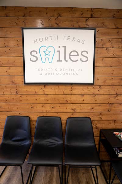 North Texas Smiles sign hanging in the waiting room